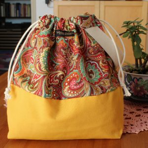 drawstring Knitting Project Bag yellow and floral paisley design with wristlet handle handmade by Lilia Vanini Liliacraftparty