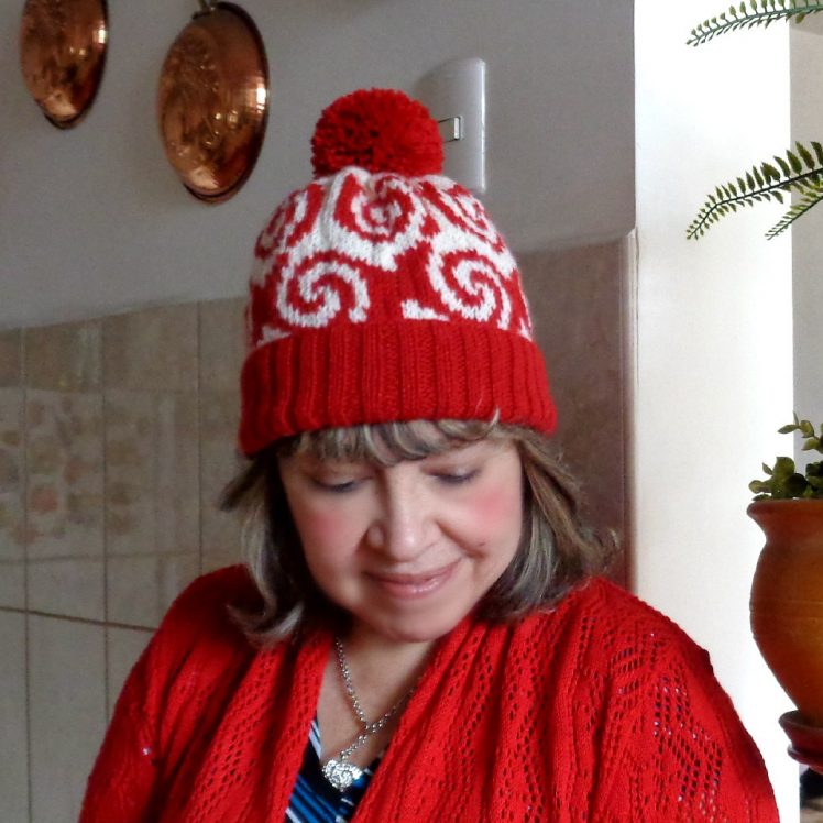 red white curly hat knitting pattern pop art hat woman wearing pop art knitting hat with pom pom